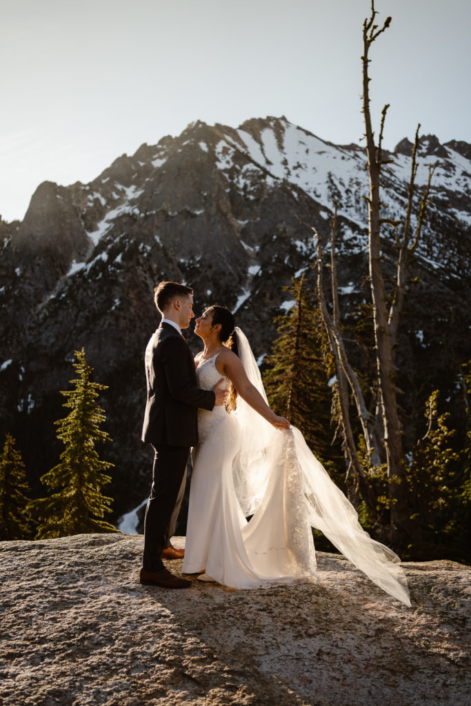 a bride and groom dance at sunrise during their north cascades elopement