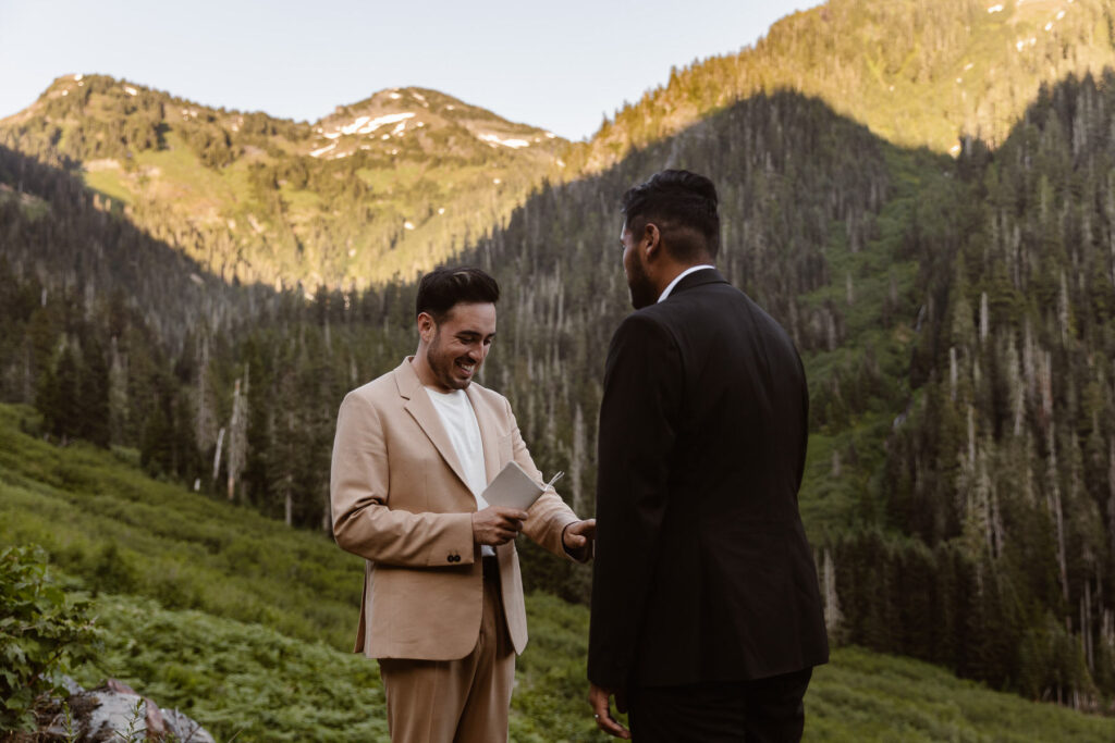 two grooms exchange vows at sunset during their north cascades elopement