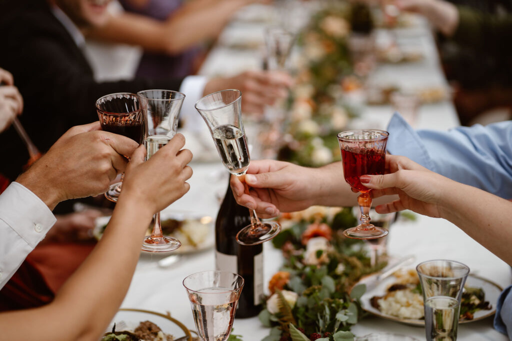 clinking glasses during a mount rainier micro wedding reception dinner