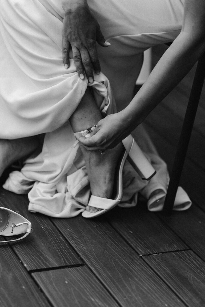 a bride buckles her shoes during her mount rainier micro wedding