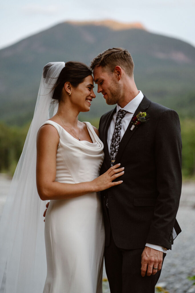 an eloping couple embraces