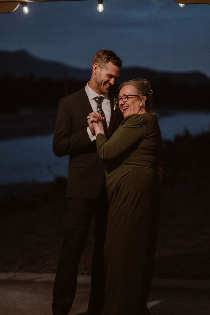 mother son dance during a mt rainier micro wedding reception